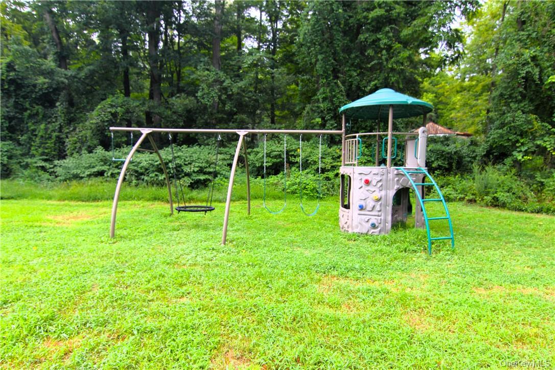 71 Miller Road, Unit 5 Hopewell Junction, NY 12533 - Photo 25 of 25 View of playground featuring a yard
