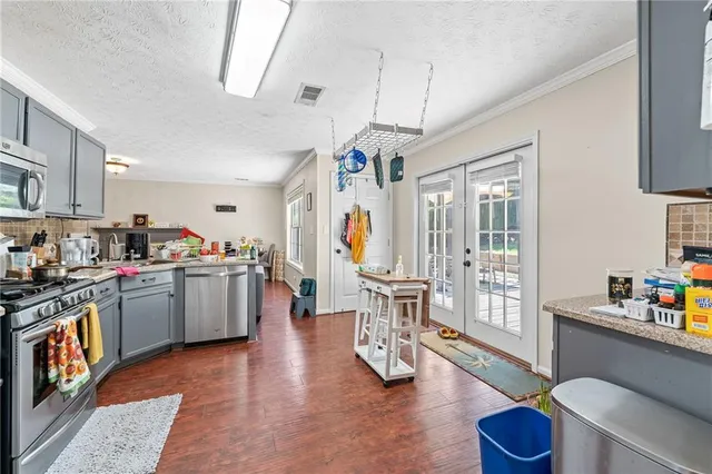 a kitchen that has a lot of cabinets