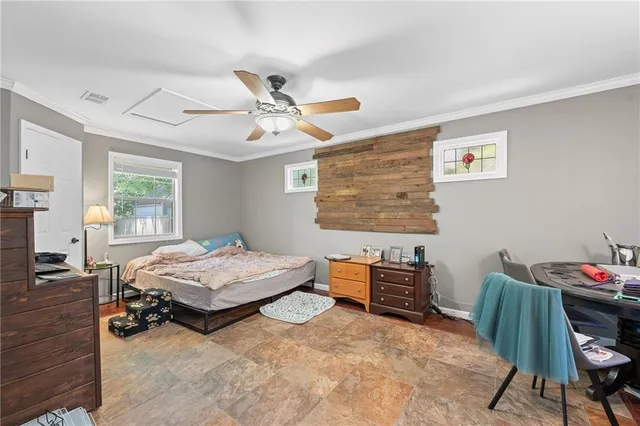 a bedroom with furniture and a window