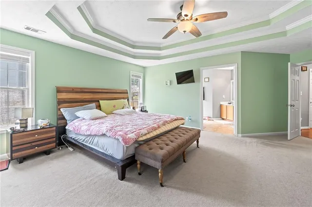 a view of kitchen with refrigerator and window