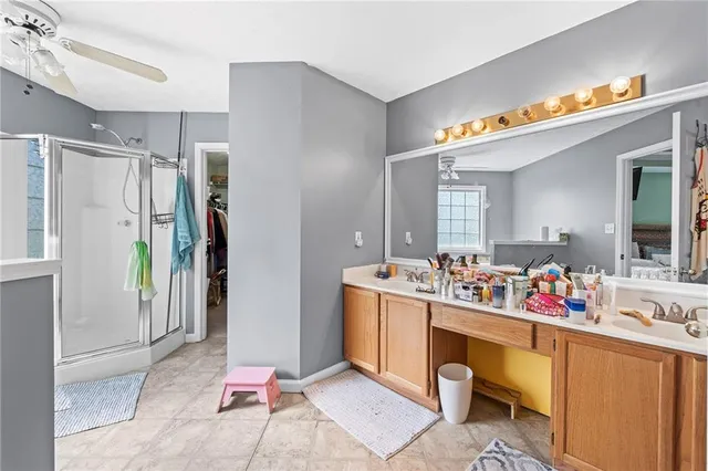 a white bath tub sitting in a bathroom next to a window