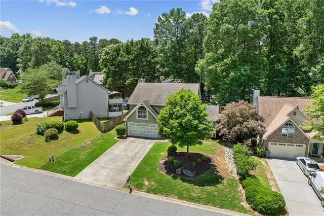an aerial view of house with yard