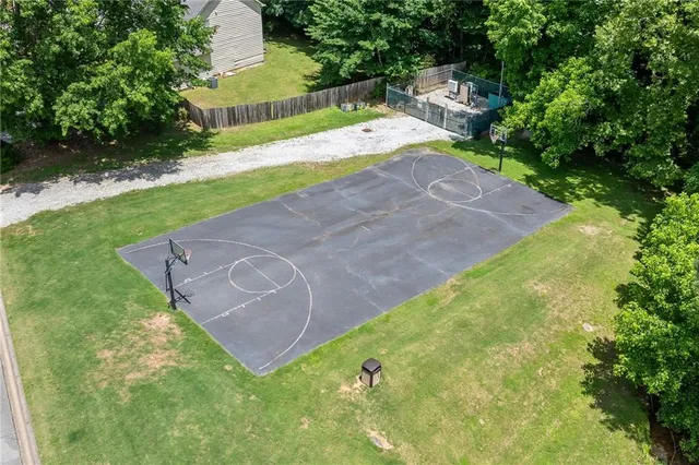 a view of a park with bench and trees