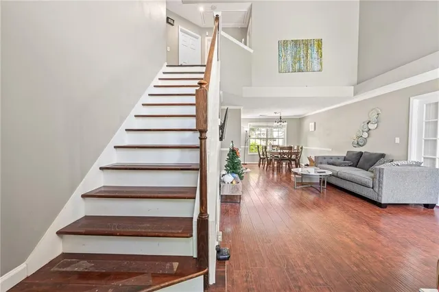 a living room with furniture and a stair