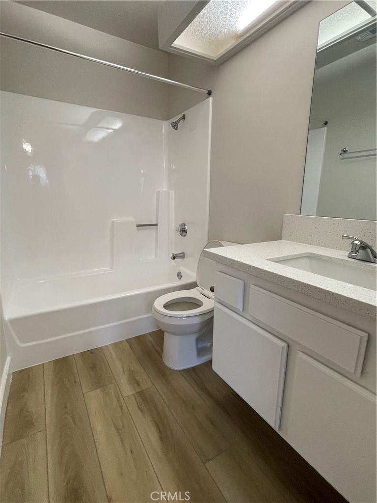 22 Country Mile Road Pomona, CA 91766 - Photo 14 of 16 a bathroom with a sink a toilet and a bathtub