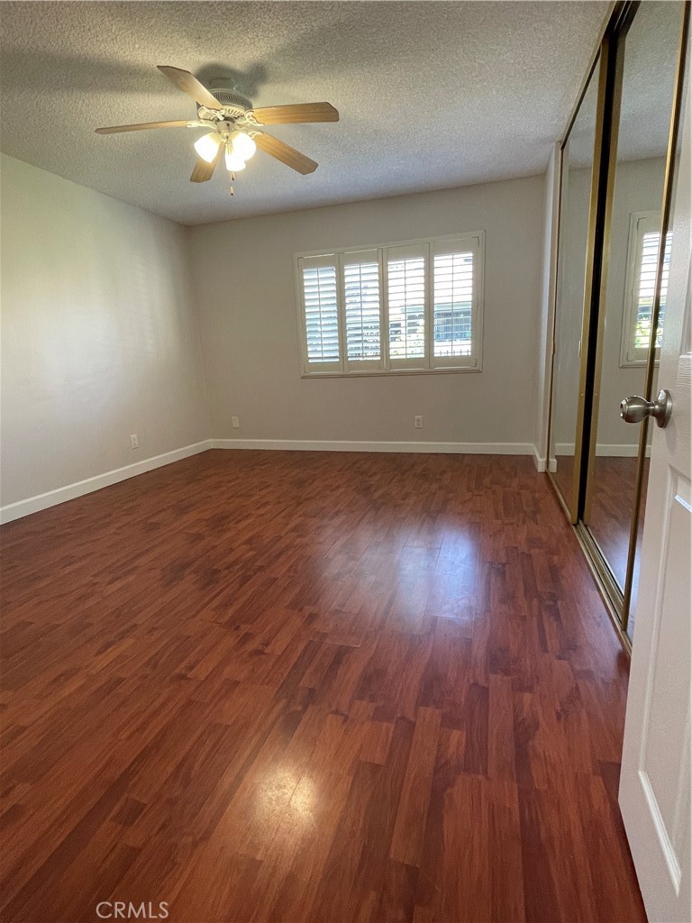 22 Country Mile Road Pomona, CA 91766 - Photo 15 of 16 a view of empty room with wooden floor and fan