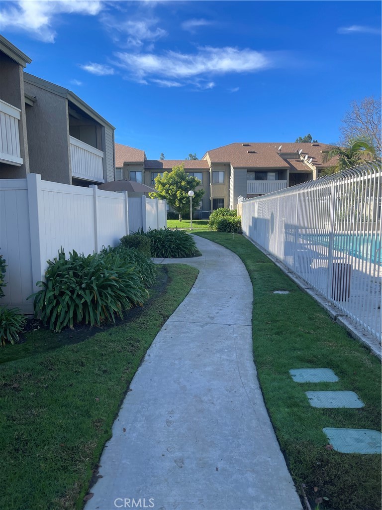22 Country Mile Road Pomona, CA 91766 - Photo 3 of 16 a view of a house with a yard