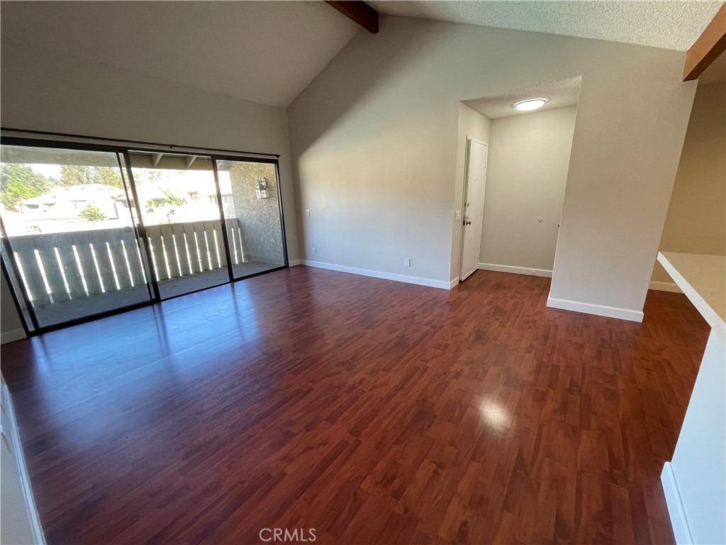 22 Country Mile Road Pomona, CA 91766 - Photo 6 of 16 an empty room with wooden floor and windows