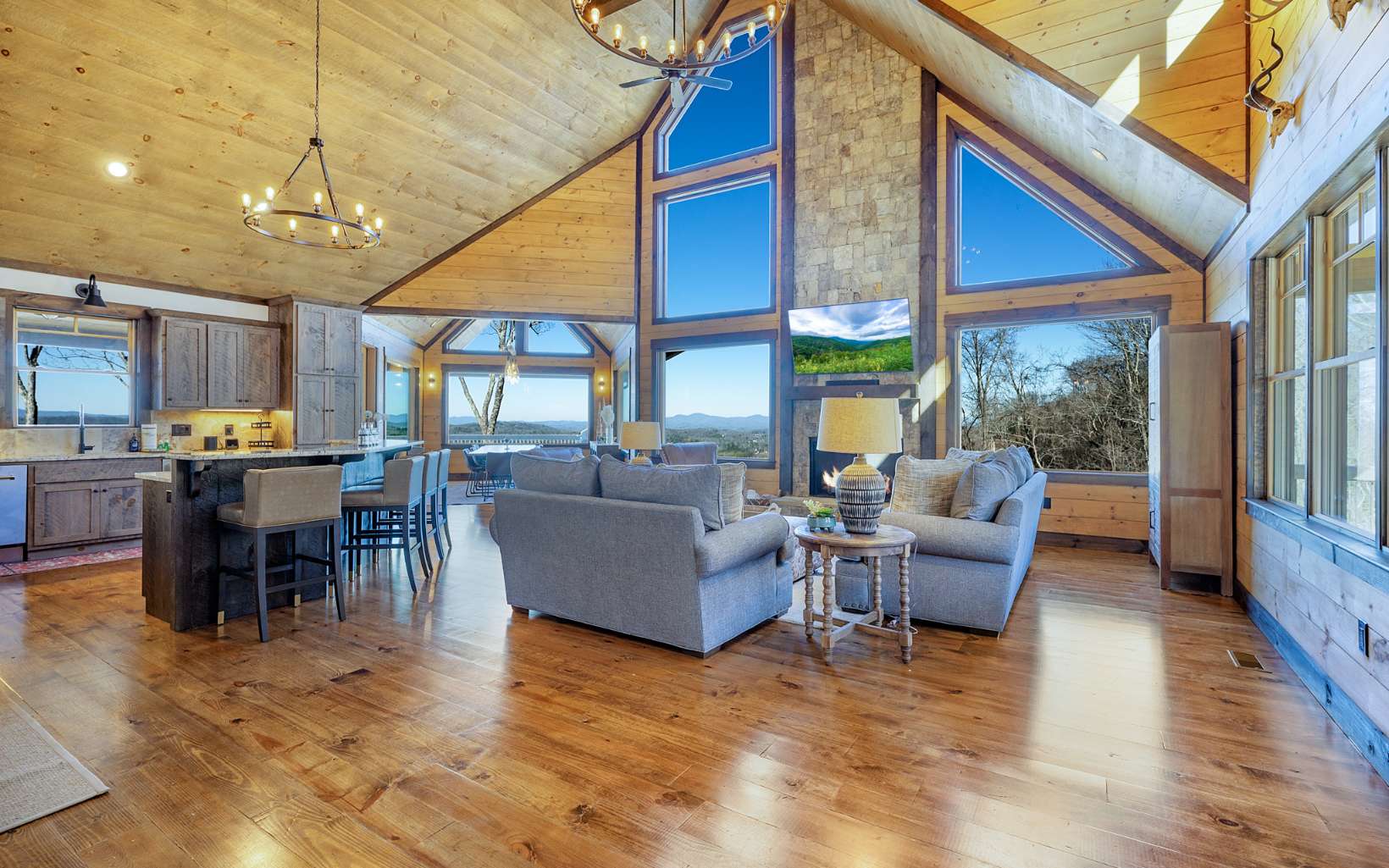 810 Overlook Drive Blue Ridge, GA 30513 - Photo 13 of 56 a living room with furniture a ceiling fan and a kitchen view