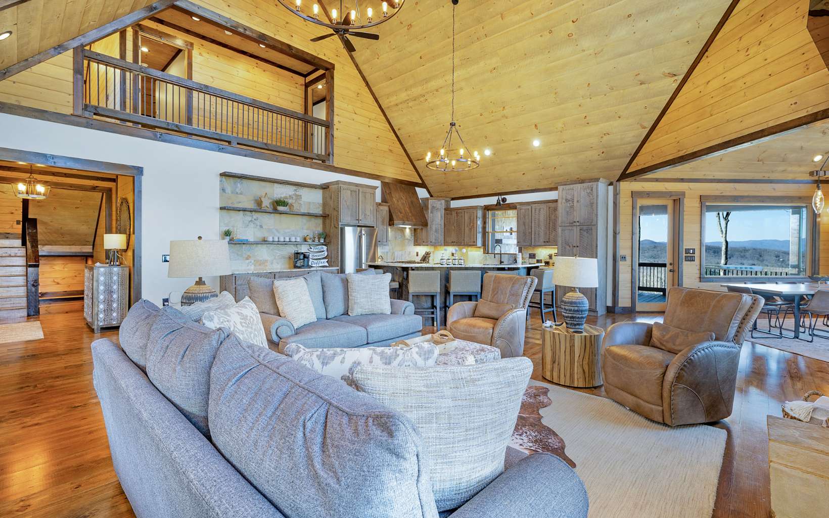 810 Overlook Drive Blue Ridge, GA 30513 - Photo 21 of 56 a living room with furniture and a chandelier