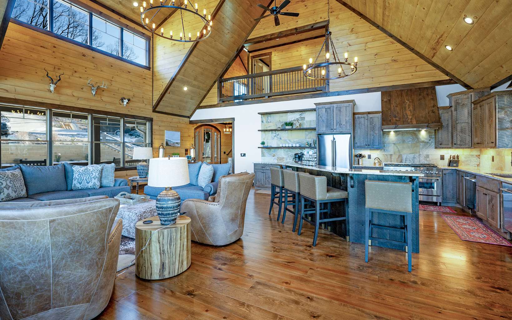 810 Overlook Drive Blue Ridge, GA 30513 - Photo 22 of 56 a living room with lots of furniture and kitchen view