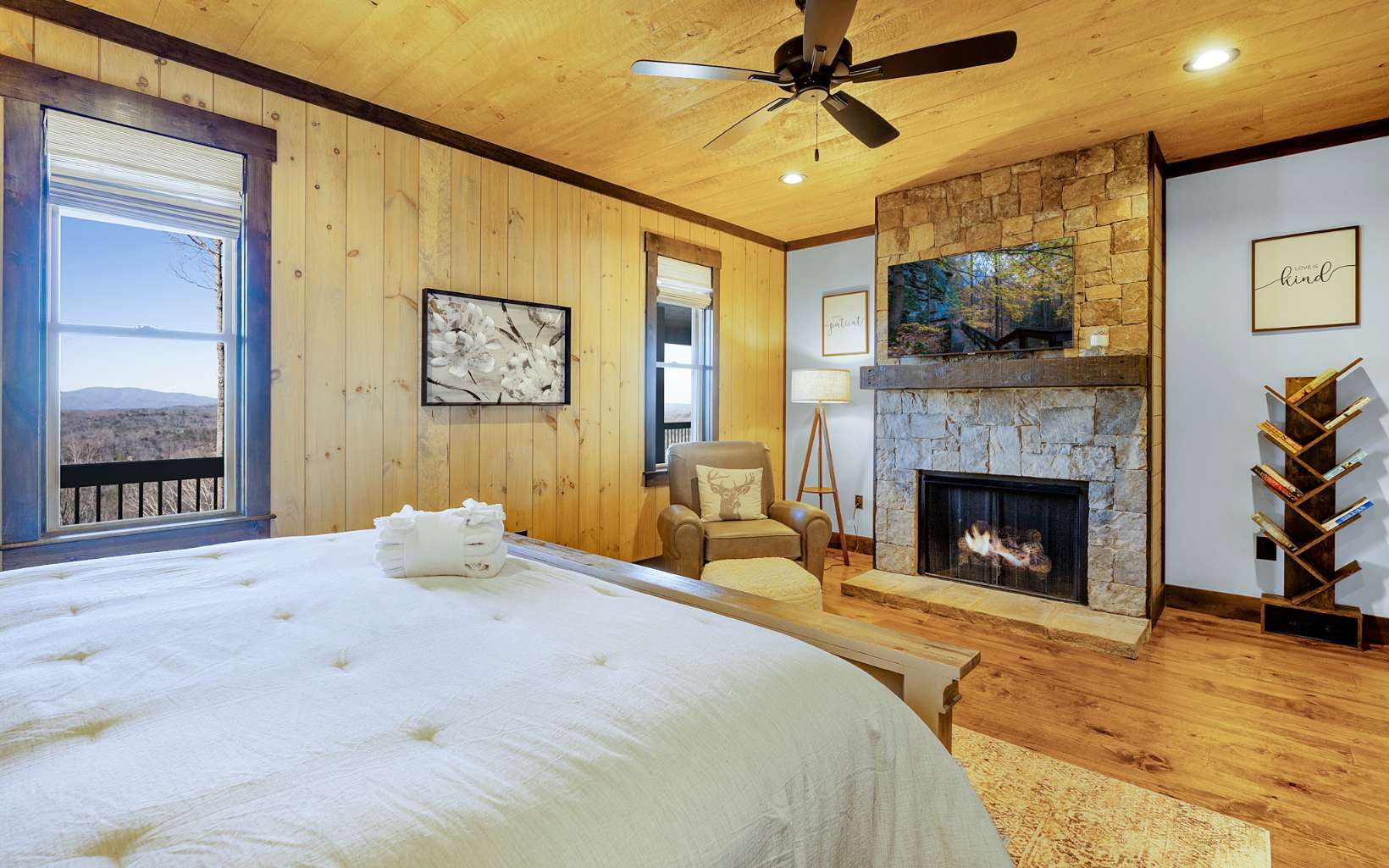 810 Overlook Drive Blue Ridge, GA 30513 - Photo 28 of 56 a bedroom with a bed and a fireplace