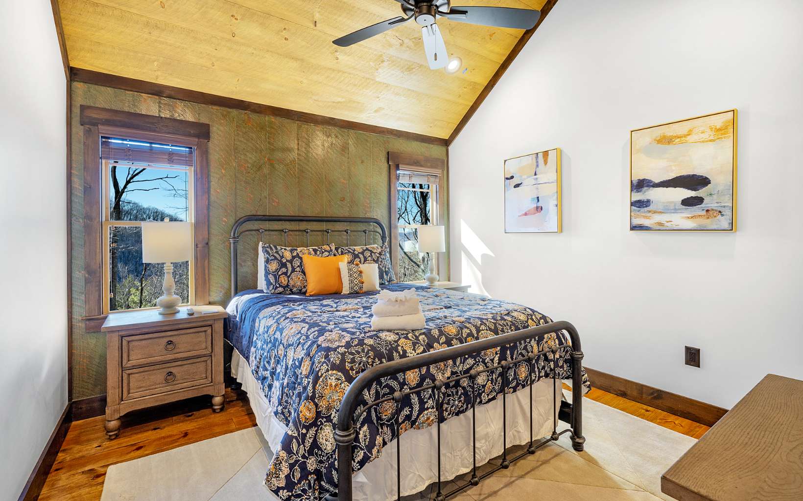 810 Overlook Drive Blue Ridge, GA 30513 - Photo 30 of 56 a bedroom with a bed and a chandelier