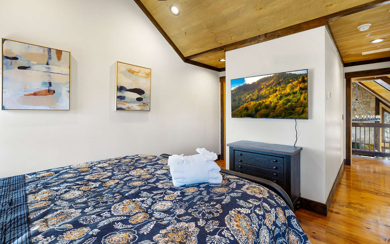 810 Overlook Drive Blue Ridge, GA 30513 - Photo 31 of 56 a bedroom with a bed and a flat screen tv