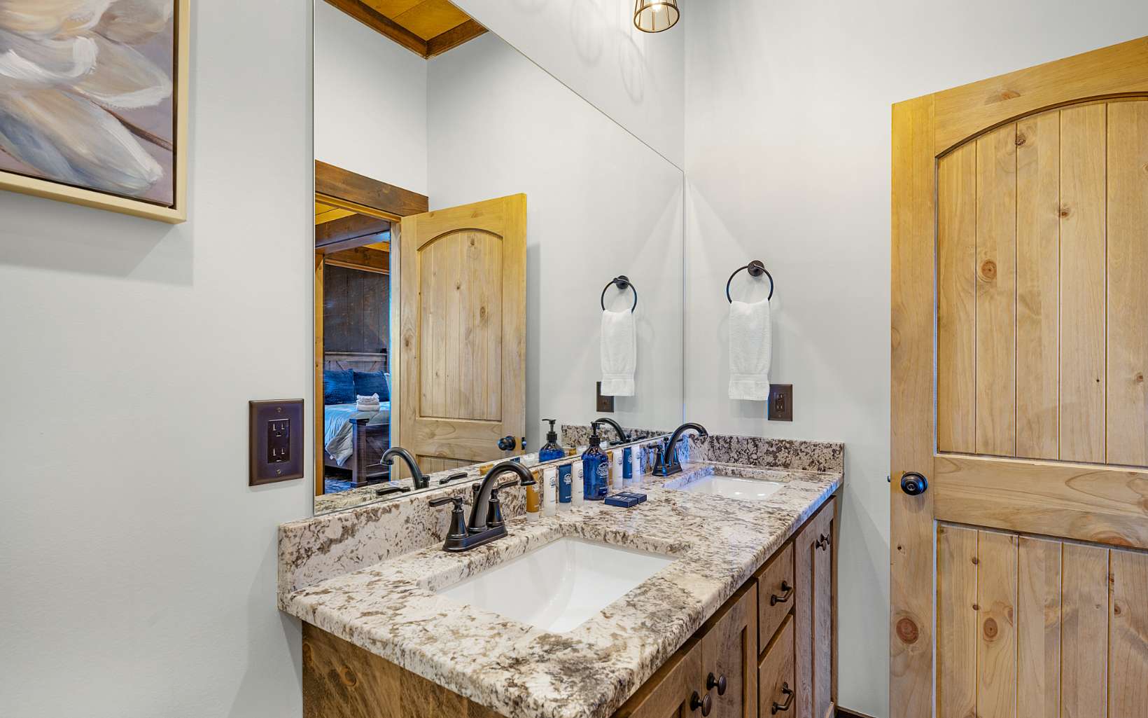 810 Overlook Drive Blue Ridge, GA 30513 - Photo 45 of 56 a bathroom with a granite countertop sink and a mirror