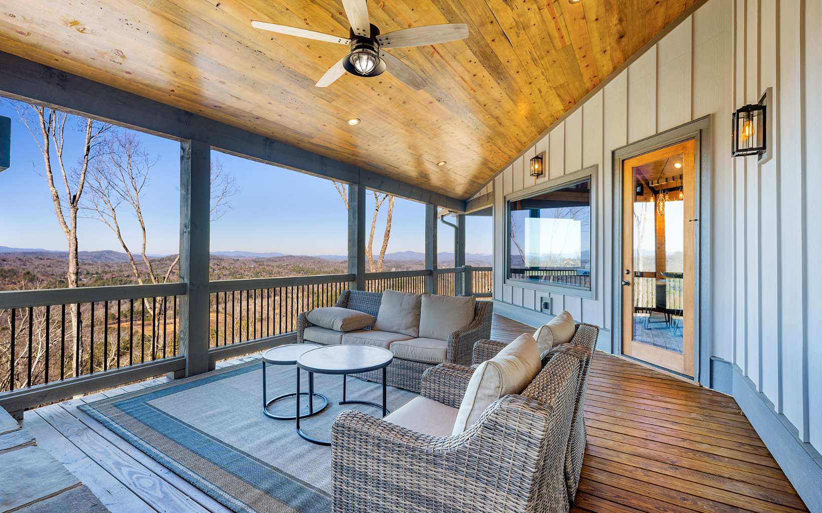 810 Overlook Drive Blue Ridge, GA 30513 - Photo 6 of 56 a balcony with furniture and wooden floor