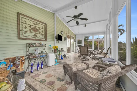 a view of a livingroom with furniture and windows