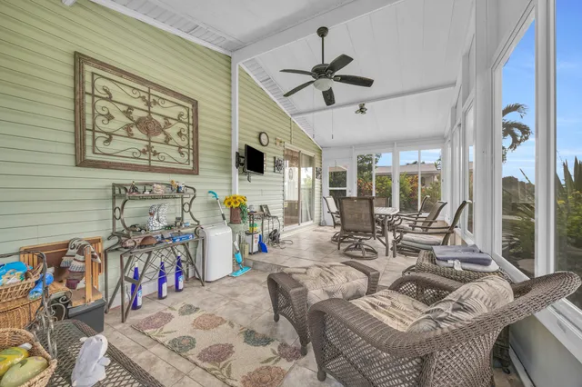 a view of a livingroom with furniture and windows
