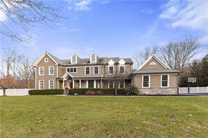 71 Parkview Road North Pound Ridge, NY 10576 - Photo 1 of 1 a front view of a house with a garden and lake view