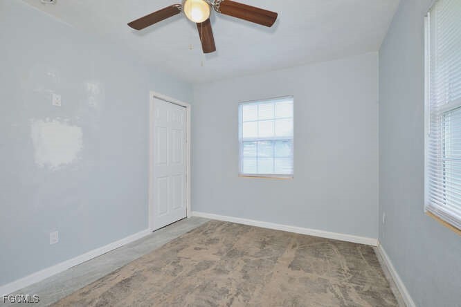 1637 Piney Road North Fort Myers, FL 33903 - Photo 15 of 41 an empty room with a window and a ceiling fan