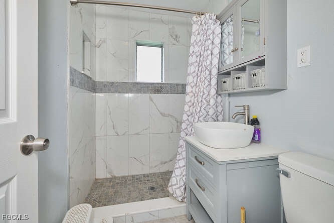 1637 Piney Road North Fort Myers, FL 33903 - Photo 16 of 41 a bathroom with a sink toilet and shower