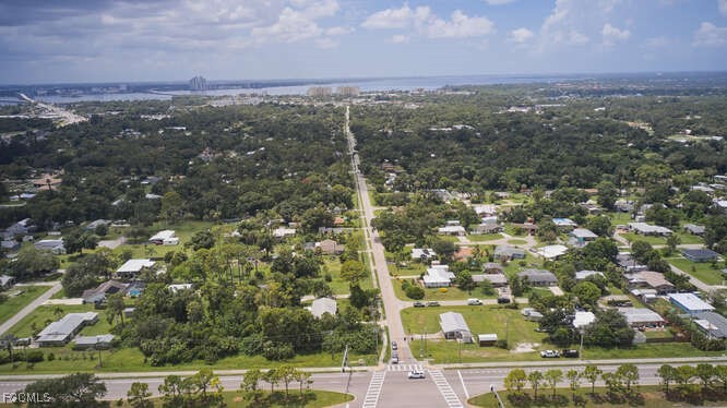 1637 Piney Road North Fort Myers, FL 33903 - Photo 27 of 41 an aerial view of residential houses with outdoor space and trees