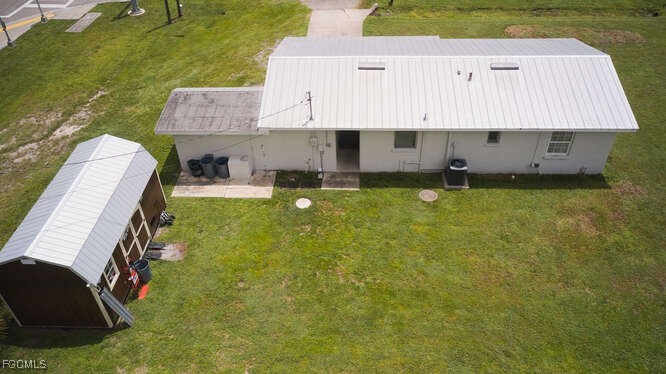 1637 Piney Road North Fort Myers, FL 33903 - Photo 28 of 41 an aerial view of a house with swimming pool garden and patio