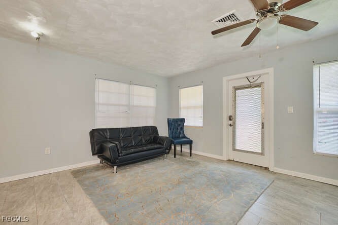 1637 Piney Road North Fort Myers, FL 33903 - Photo 5 of 41 a living room with furniture and a air conditioner vent