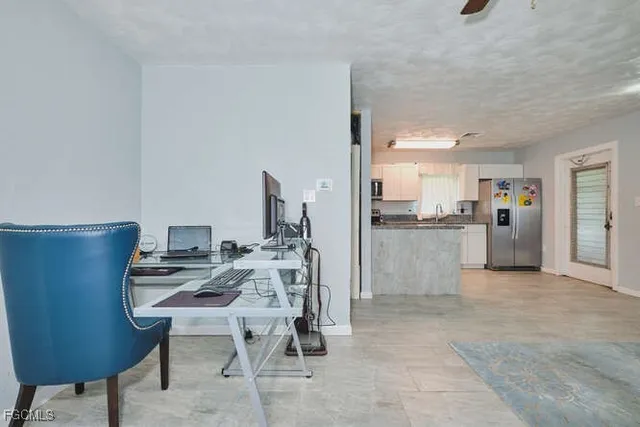 a view of a workspace with furniture