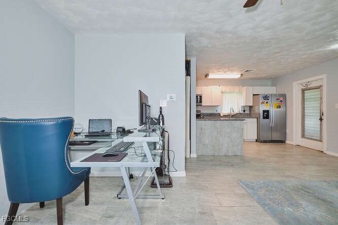 1637 Piney Road North Fort Myers, FL 33903 - Photo 9 of 41 a view of a workspace with furniture