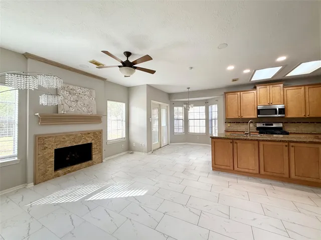 a view of a kitchen with a stove cabinets and a fireplace