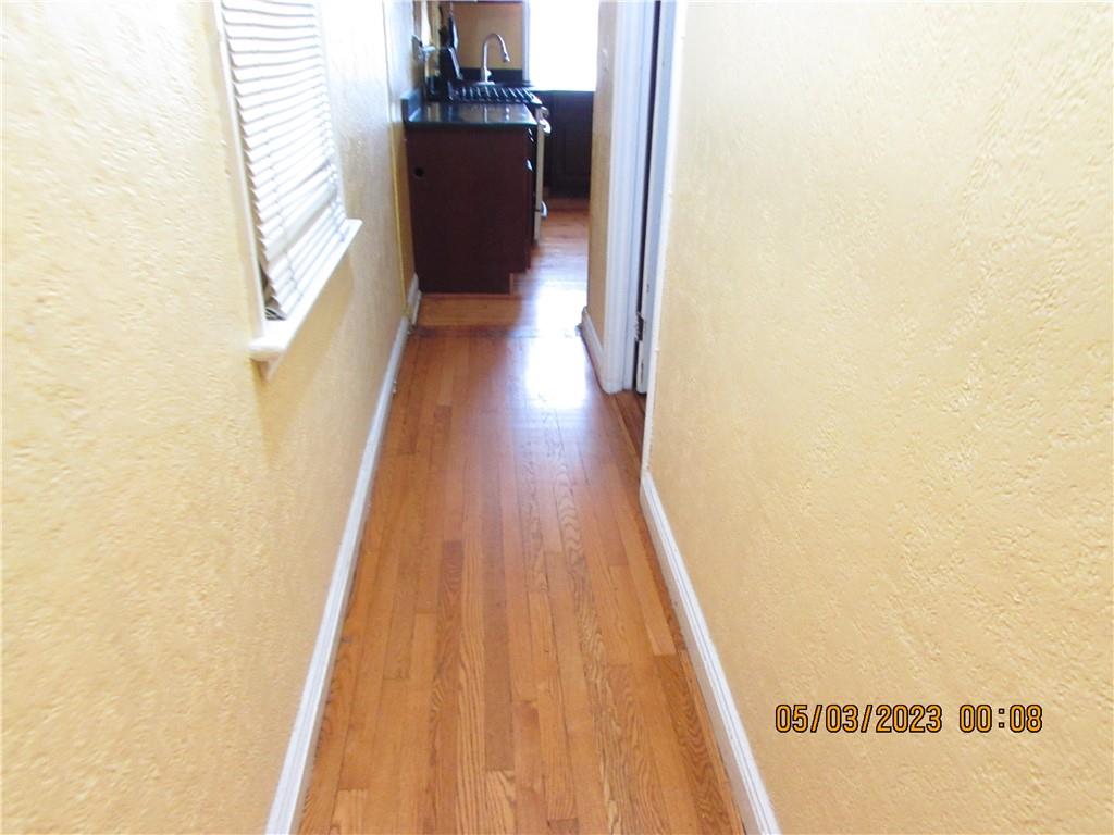 2806 Sexton Place Bronx, NY 10469 - Photo 17 of 18 a view of a hallway with wooden floor