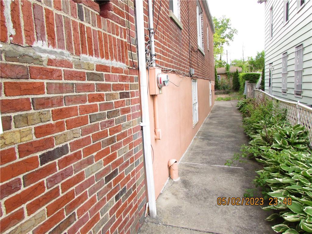 2806 Sexton Place Bronx, NY 10469 - Photo 3 of 18 a view of a pathway both side of building