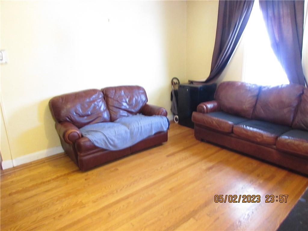 2806 Sexton Place Bronx, NY 10469 - Photo 6 of 18 a living room with a couch and a table