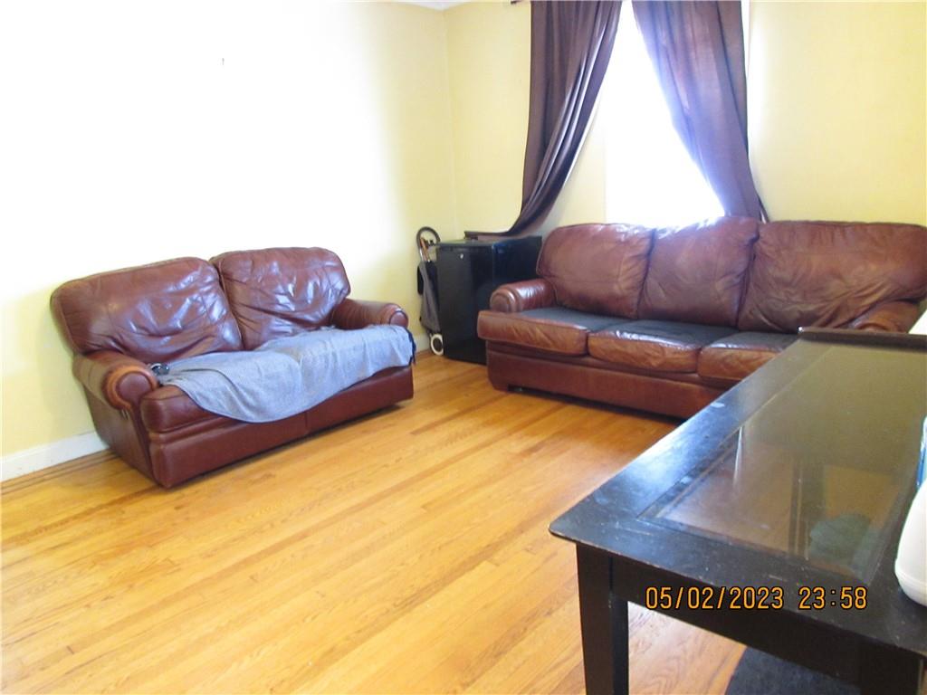2806 Sexton Place Bronx, NY 10469 - Photo 8 of 18 a living room with furniture and a window