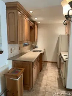 a utility room with a sink a washer and dryer