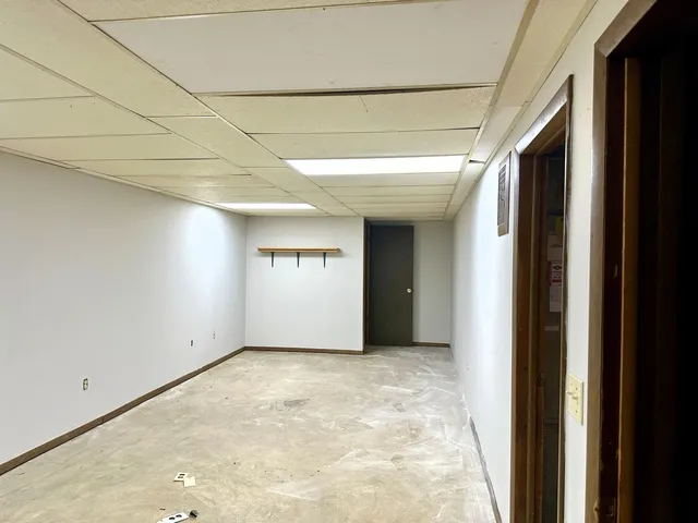 a view of a room with a wooden floor