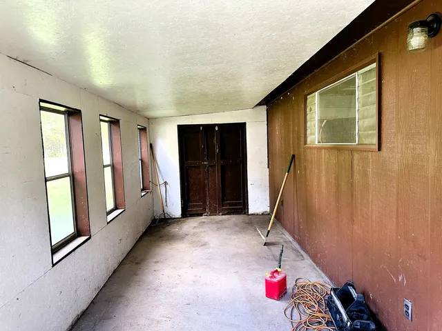 a front view of a house with a garden and yard