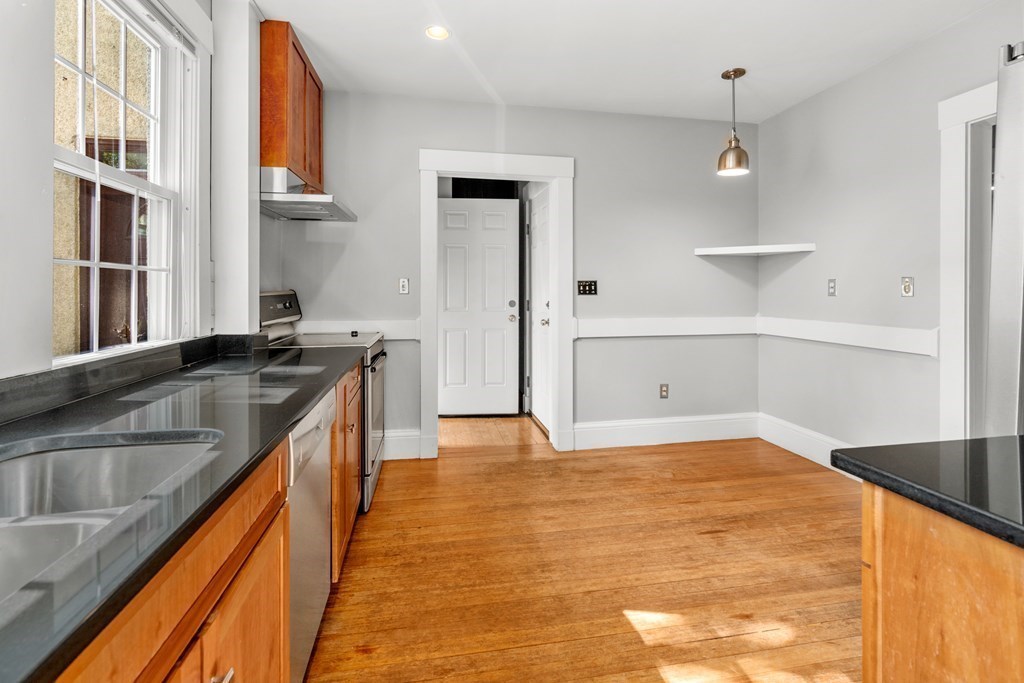 34 Weston Road Wellesley, MA 02482 - Photo 11 of 19 a kitchen with stainless steel appliances granite countertop a sink and cabinets