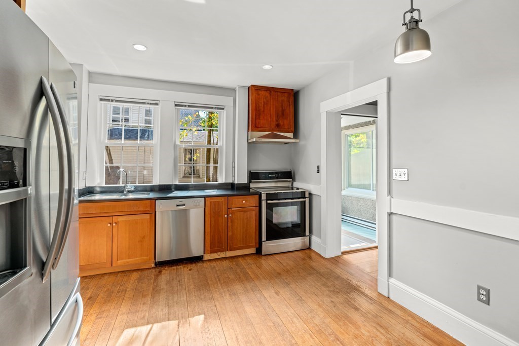 34 Weston Road Wellesley, MA 02482 - Photo 12 of 19 a kitchen with granite countertop a refrigerator and a sink