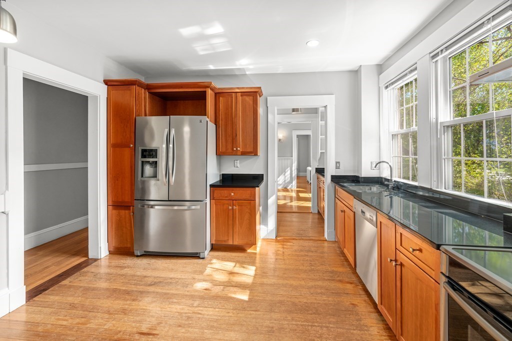 34 Weston Road Wellesley, MA 02482 - Photo 13 of 19 a kitchen with stainless steel appliances granite countertop a refrigerator a stove and a sink