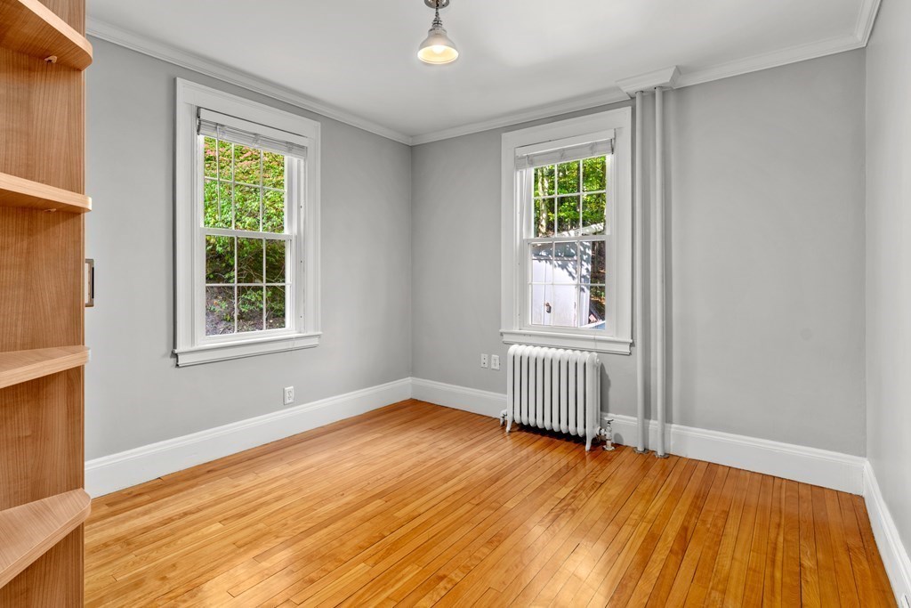 34 Weston Road Wellesley, MA 02482 - Photo 16 of 19 a view of an empty room with wooden floor and a window