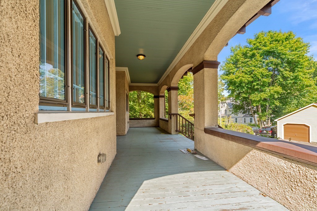 34 Weston Road Wellesley, MA 02482 - Photo 17 of 19 a view of a balcony with wooden floor and couch