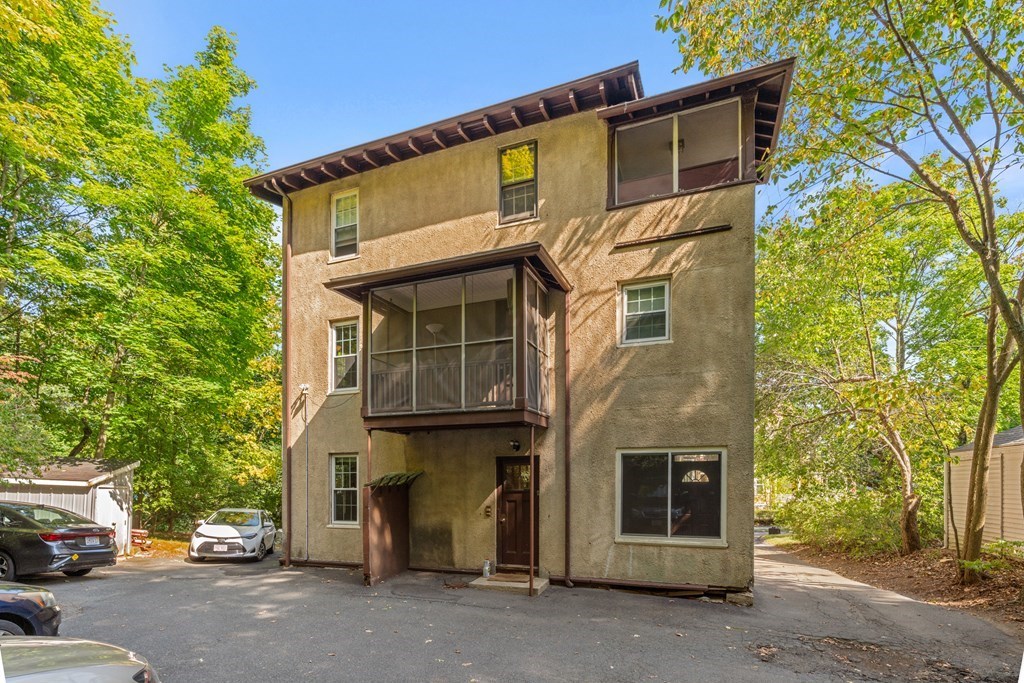 34 Weston Road Wellesley, MA 02482 - Photo 2 of 19 a front view of a building with parking