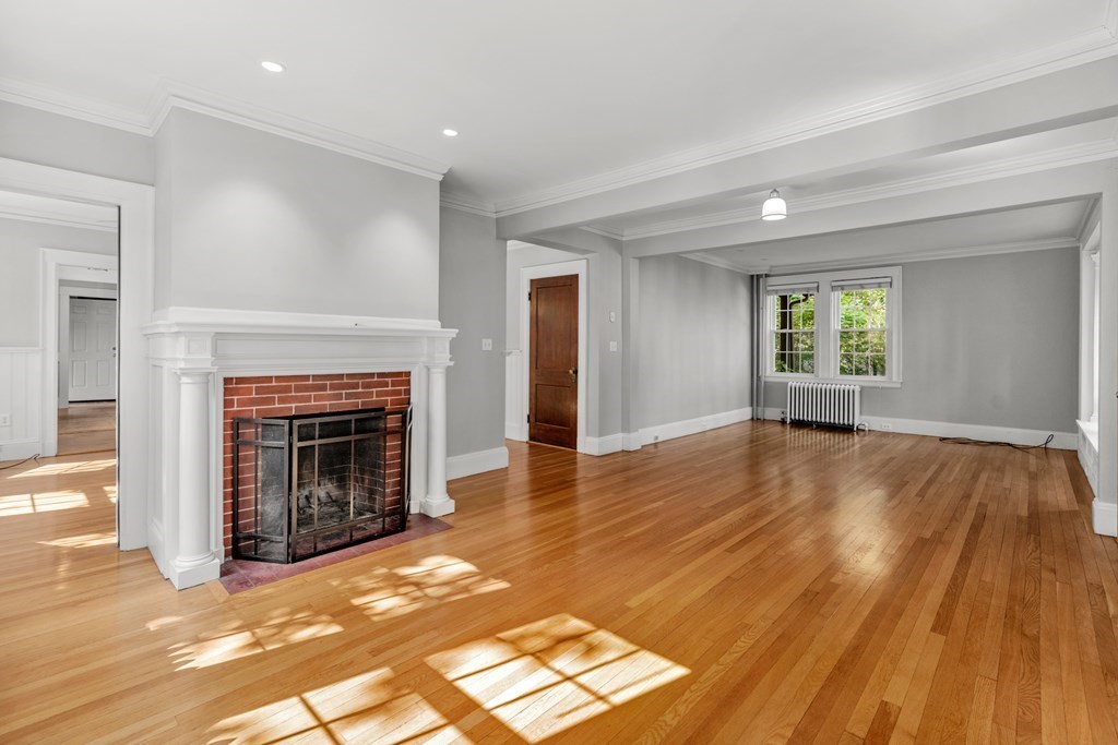 34 Weston Road Wellesley, MA 02482 - Photo 6 of 19 a view of an empty room with window and fire place