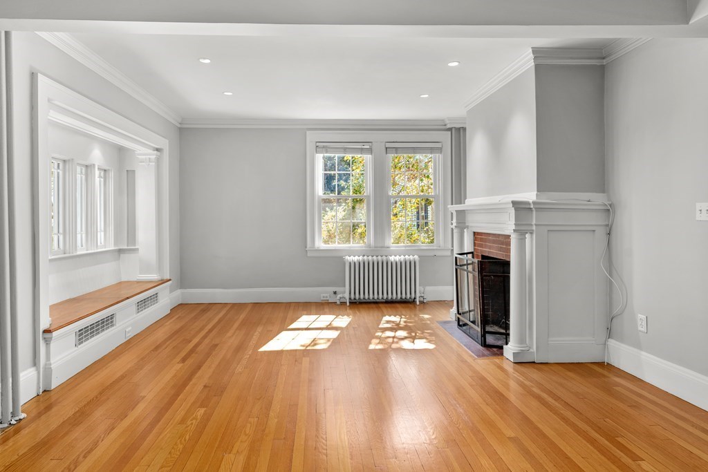 34 Weston Road Wellesley, MA 02482 - Photo 7 of 19 a view of an empty room with window and fireplace