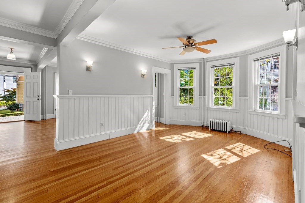34 Weston Road Wellesley, MA 02482 - Photo 9 of 19 a view of an empty room with window and wooden floor