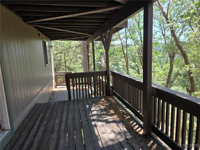 a view of balcony with wooden floor