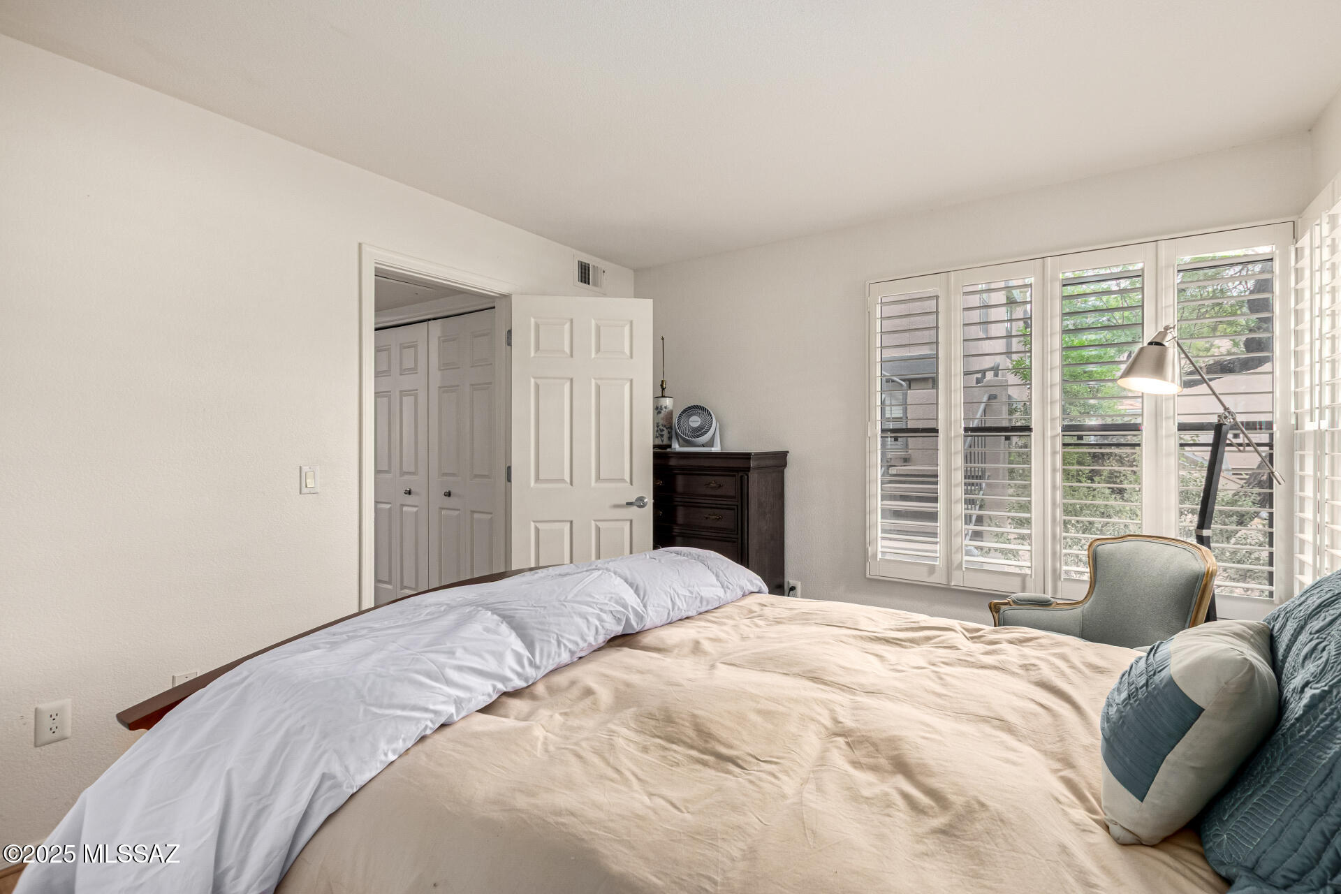 5855 North Kolb Road, Unit 8102 Tucson, AZ 85750 - Photo 10 of 28 a bedroom with a bed and a large window