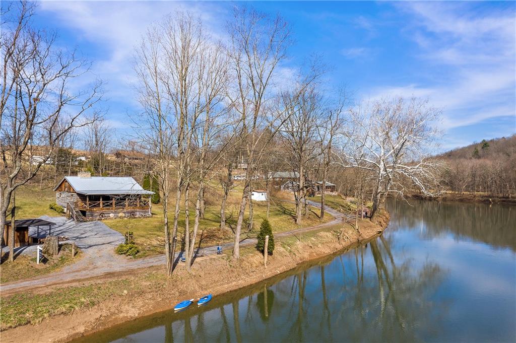 357 Burkett Bridge Road Everett, PA 15537 - Photo 11 of 25 a view of a swimming pool with an outdoor seating